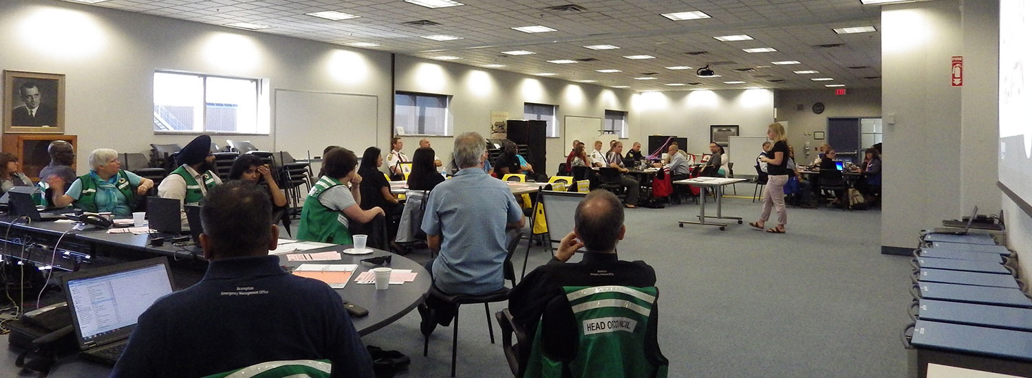 Banner - Group of people listening to a presentation on emergency management